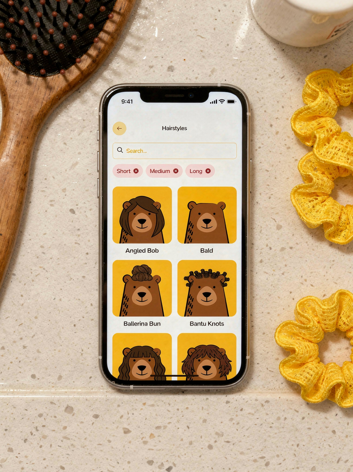 On a bathroom countertop with bright lighting and a hairbrush with a few yellow hair scrunchies