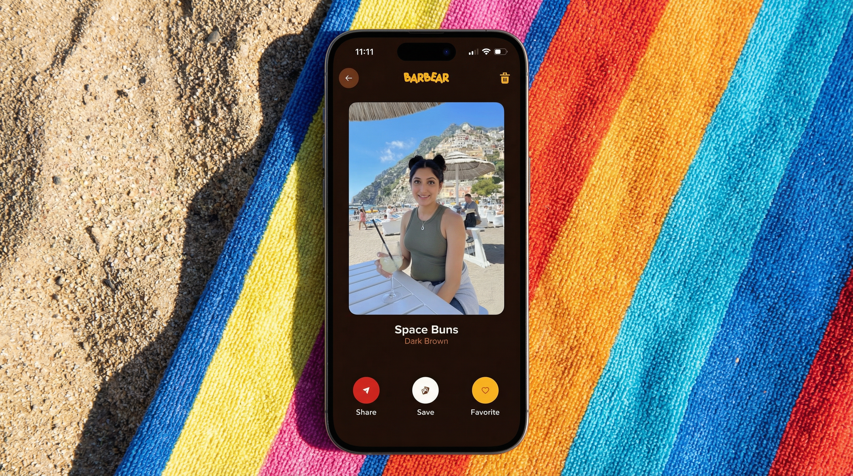 On a beach towel on sand with bright sunny lighting